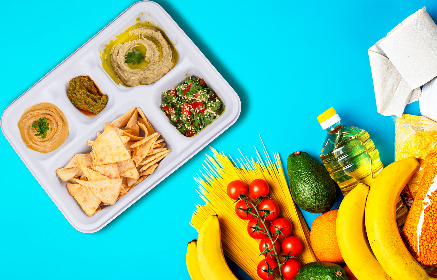 delivery-goods-blue-surface-banana-tomato-avocado-orange-pasta-oil-lentils-hummus-pita-chips-tabouleh-tahini-labneh-baba-ganoush-food-5-Compartment-Meal-Trays-Compostable-Sugarcane-Bagasse-Tray-Plates